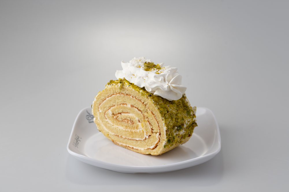 Mango roll cake on a plate